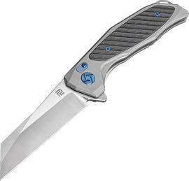 A gray Artisan Megahawk Framelock folding knife with a satin finish S35VN stainless blade and a gray titanium handle with carbon fiber inlay. It features an extended tang, lanyard hole, and pocket clip. | King of Knives e-store