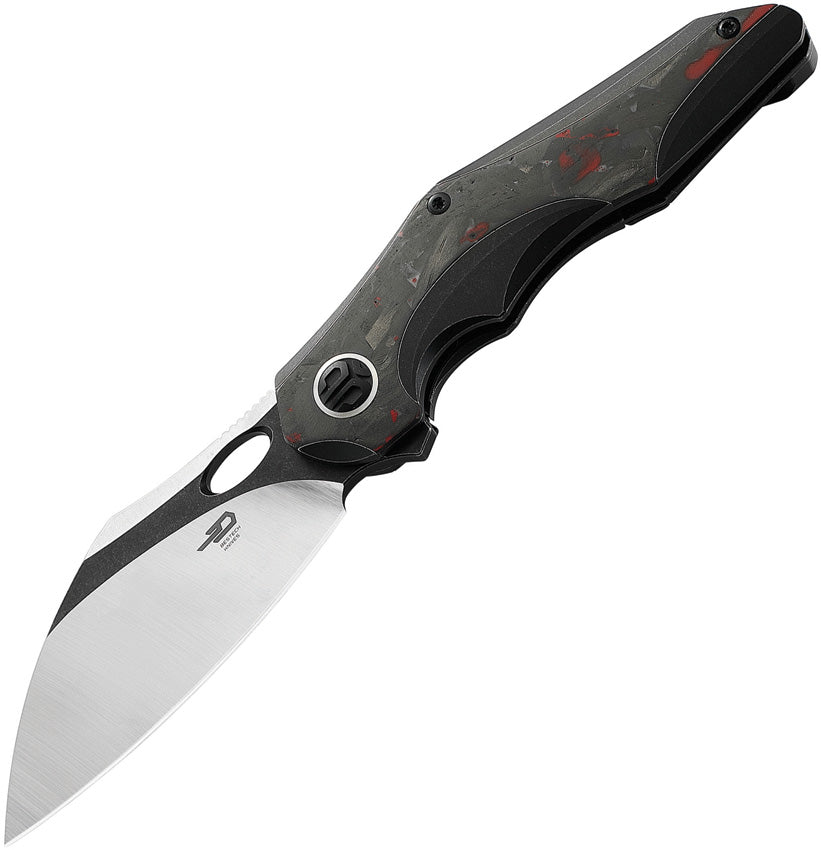 A folded pocket knife with a black titanium handle and black stonewash and satin finish blade, featuring red marble carbon fiber inlay on the handle.