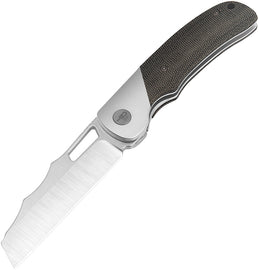 A black folding knife with a satin finish blade, titanium bolster, and black canvas micarta handle, featuring a thumb pull and a lanyard hole.