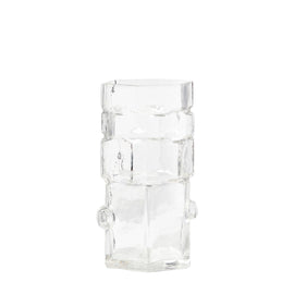 A clear geometric glass vase with stacked hexagonal shapes.