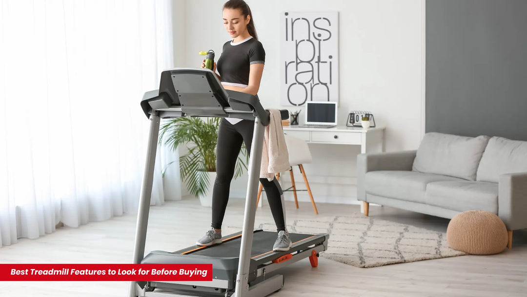 A woman checking the treadmill features