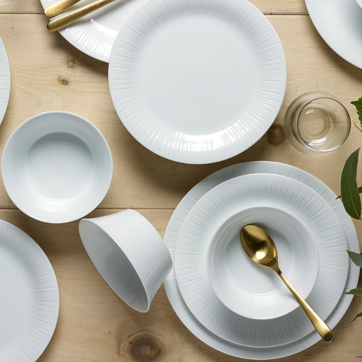 Noritake Conifere Cake Plates and Bowls with various sizes, white, Gold Spoon on top of a stack