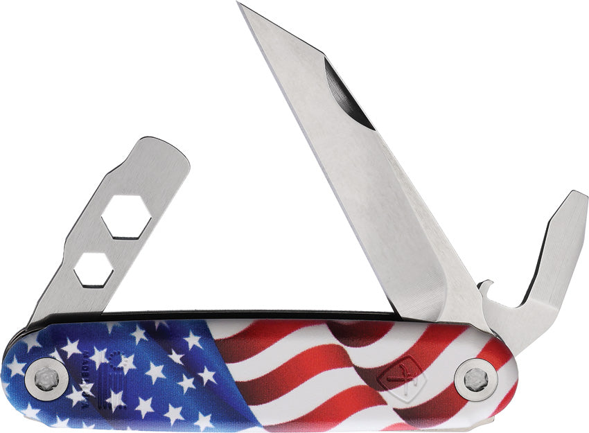 A folding knife with an American flag pattern on the handle, featuring a stainless steel blade and additional tools such as a bottle opener and wrench.