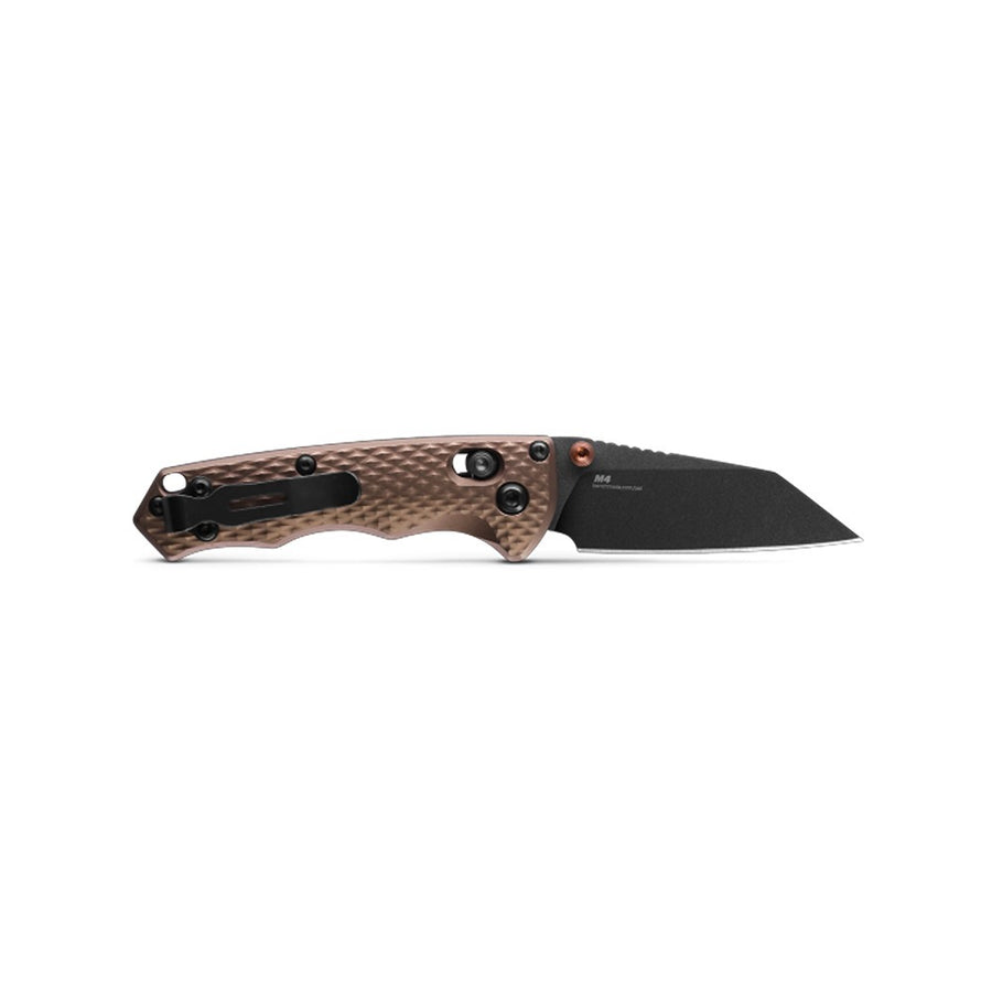 A Benchmade 290Bk-1 folding knife with a 63mm CPM-M4 blade and an anodized aluminum handle in Flat Dark Earth color.