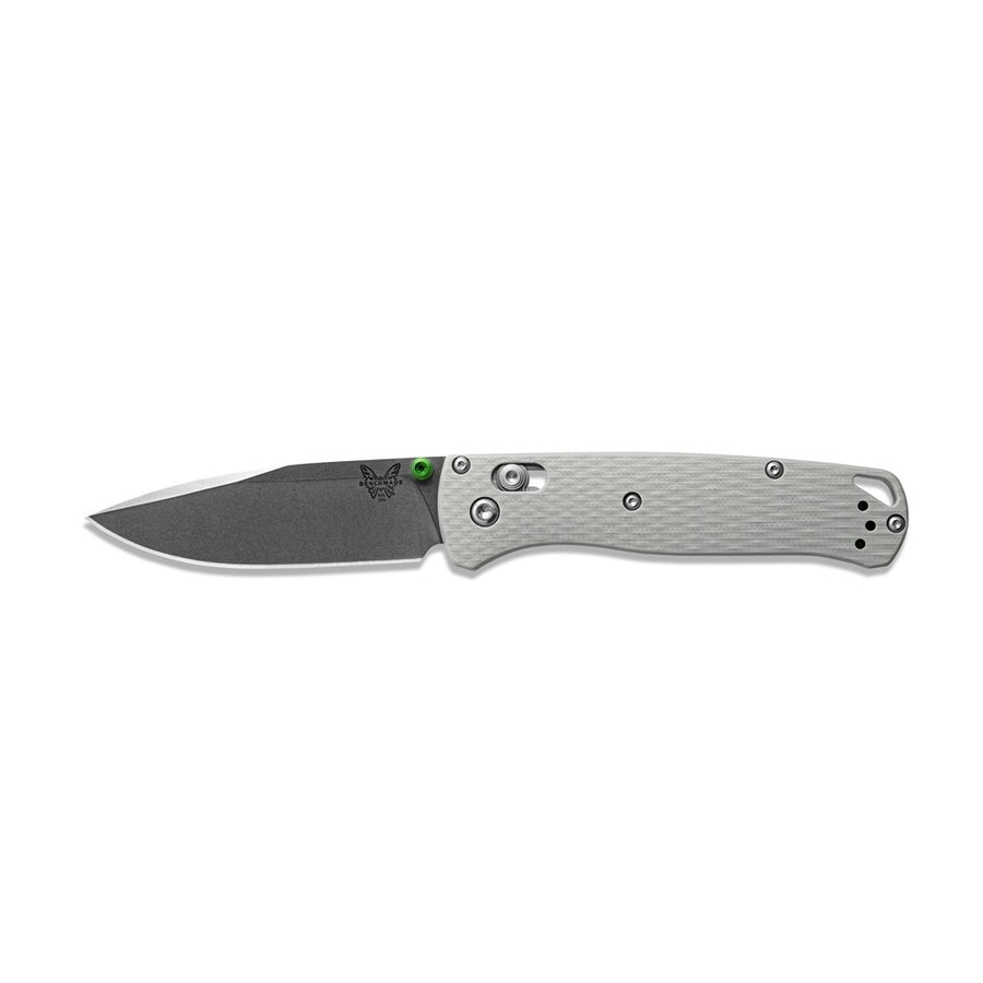 A folding knife with a grey G10 handle and green accents, featuring a Benchmade logo on the blade.