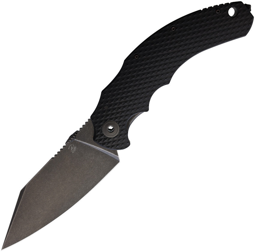 A folding knife with a black stonewash finish blade and black finger grooved G10 handle, featuring a titanium back handle and thumb disk. Also includes a lanyard hole, glass breaker, and pocket clip.
