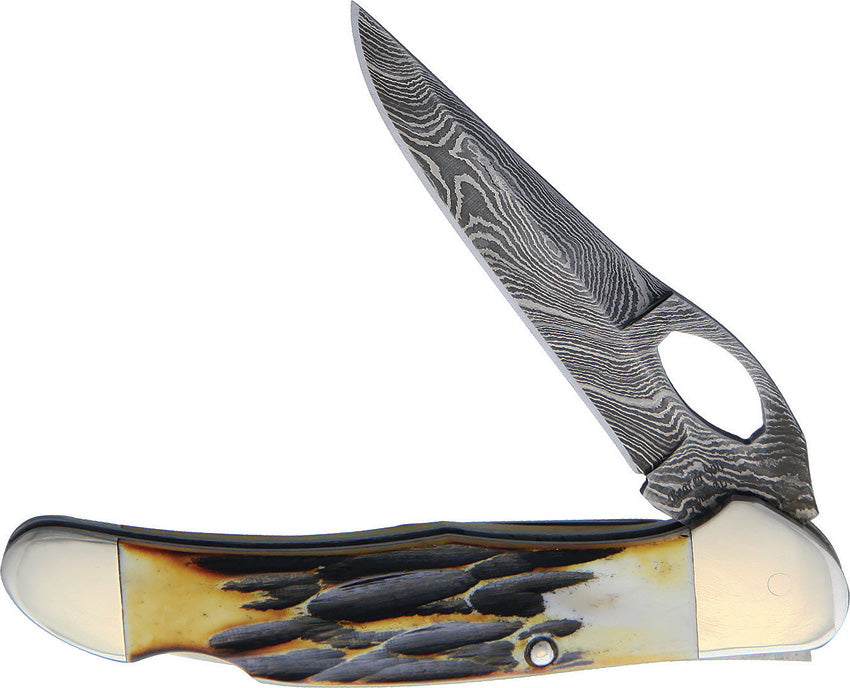 A Bear & Son folding knife with a Damascus steel blade and India stag bone handle, featuring a thumb pull and nickel silver bolster. King of Knives e-store