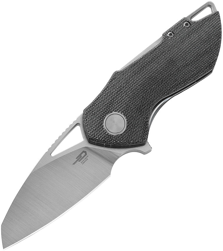 A black folding knife with a satin finish blade, black canvas micarta handle, and a linerlock mechanism.