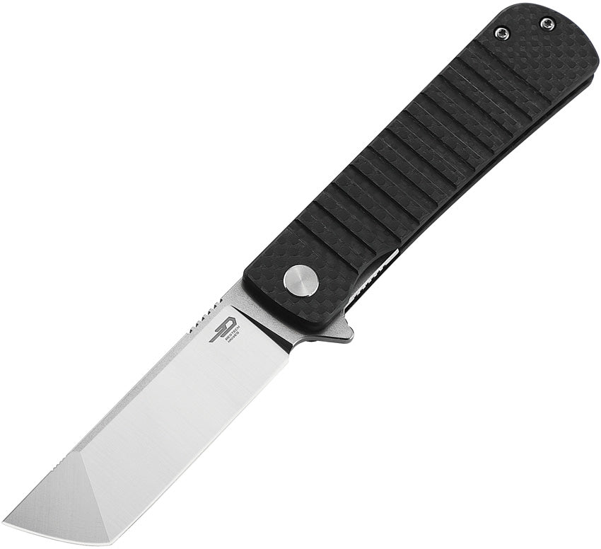 A black folding knife with a satin finish blade, extended tang, and G10 carbon fiber handle, featuring a linerlock mechanism.
