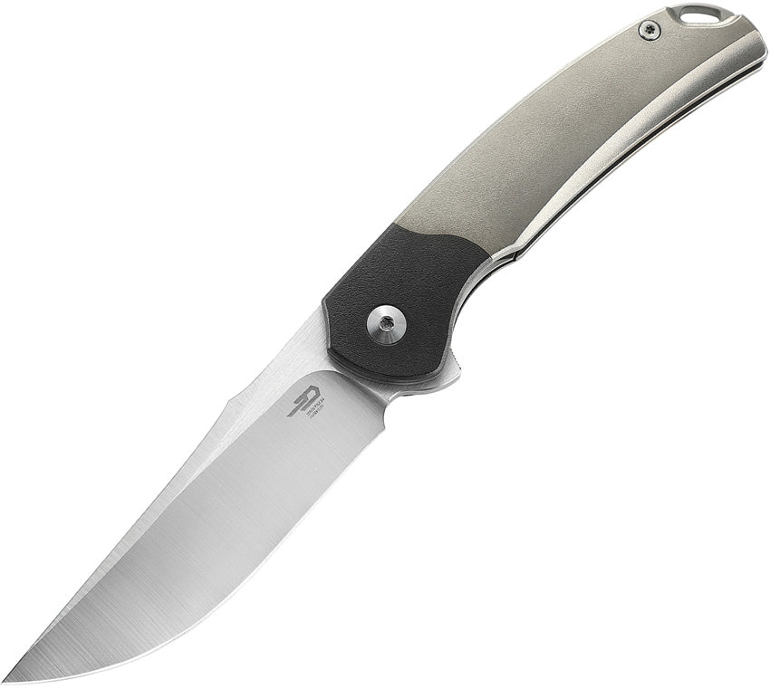 A folded hunting knife with a gray titanium handle and a satin finish blade, featuring a liner lock mechanism.