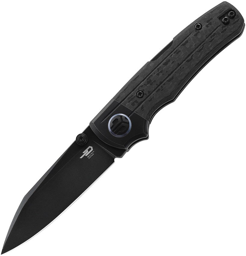 A black folding knife with a stonewash finish blade and carbon fiber handle, featuring a lockback mechanism, thumb stud, and pocket clip.