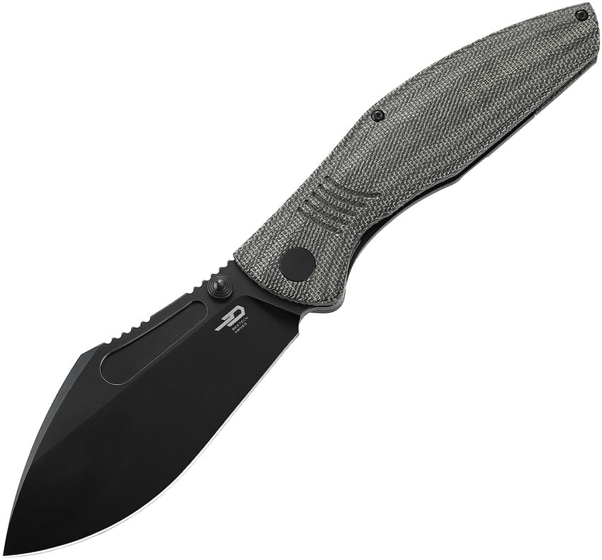 A black folding knife with a micarta handle and a black titanium frame, with the blade closed. The knife has a textured handle and a smooth black blade.