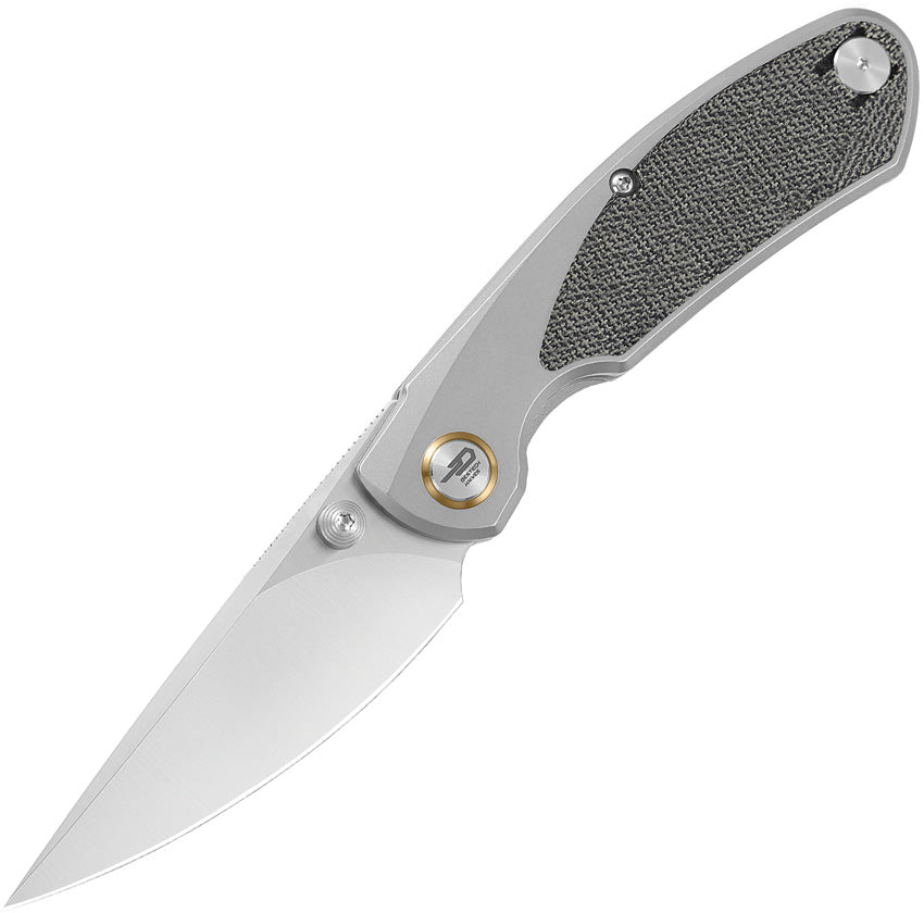 A folded pocket knife with a satin finish blade and a titanium handle with black micarta inlay, including a thumb stud and pocket clip, closed position.