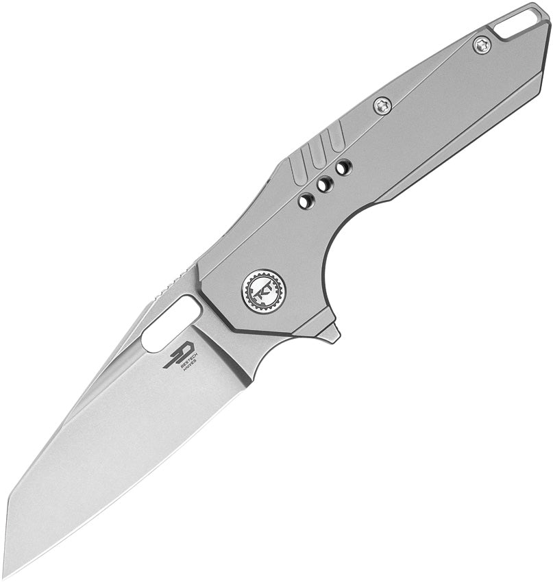 A folded pocket knife with a gray titanium handle and a bead blast finish stainless steel blade, featuring a frame lock mechanism.