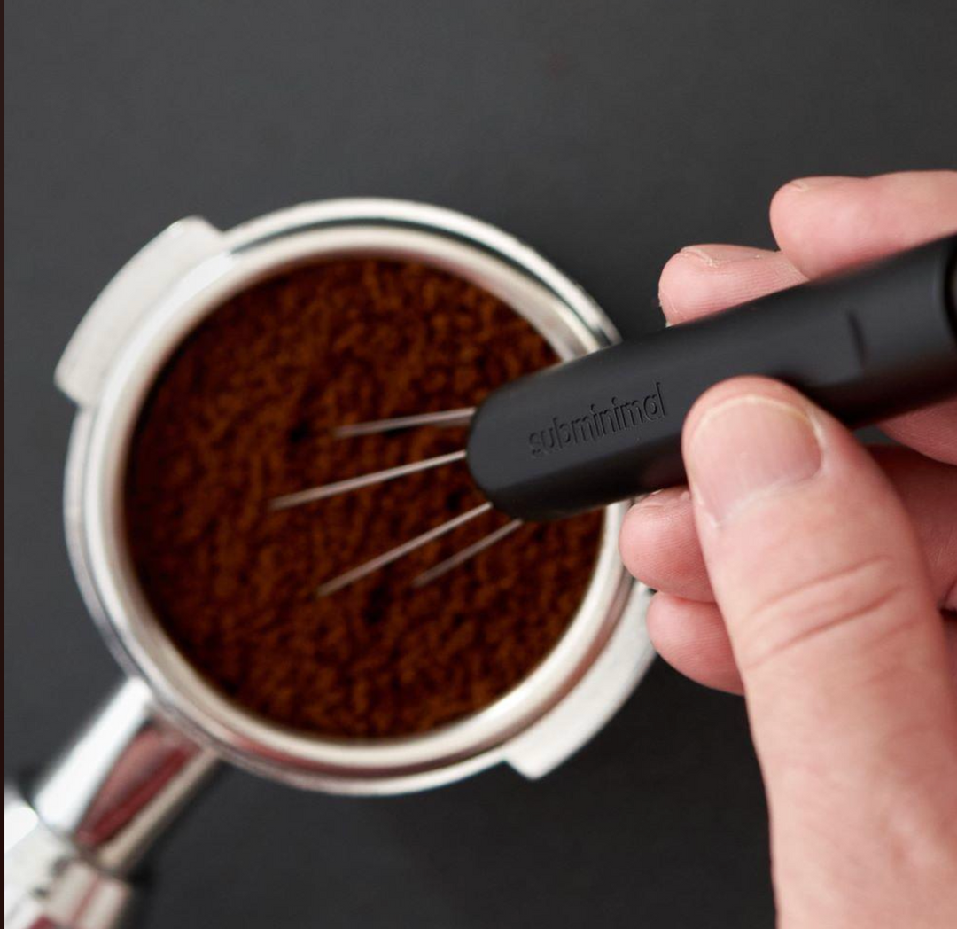 Subminimal Flick WDT Pen distributing coffee grounds