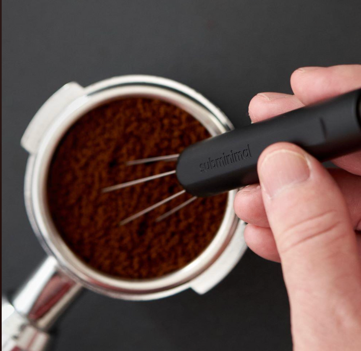 Subminimal Flick WDT Pen distributing coffee grounds