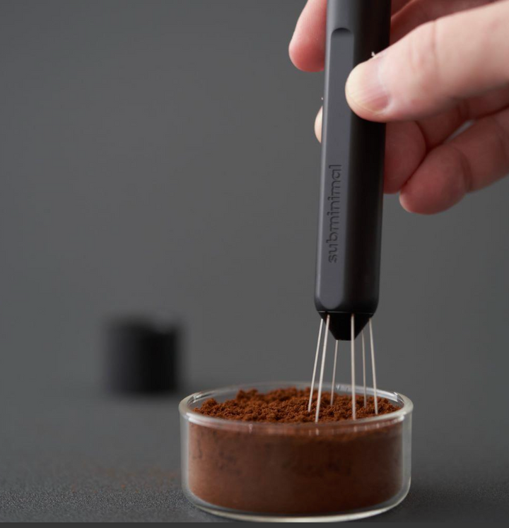 Subminimal Flick WDT Pen distributing coffee grounds