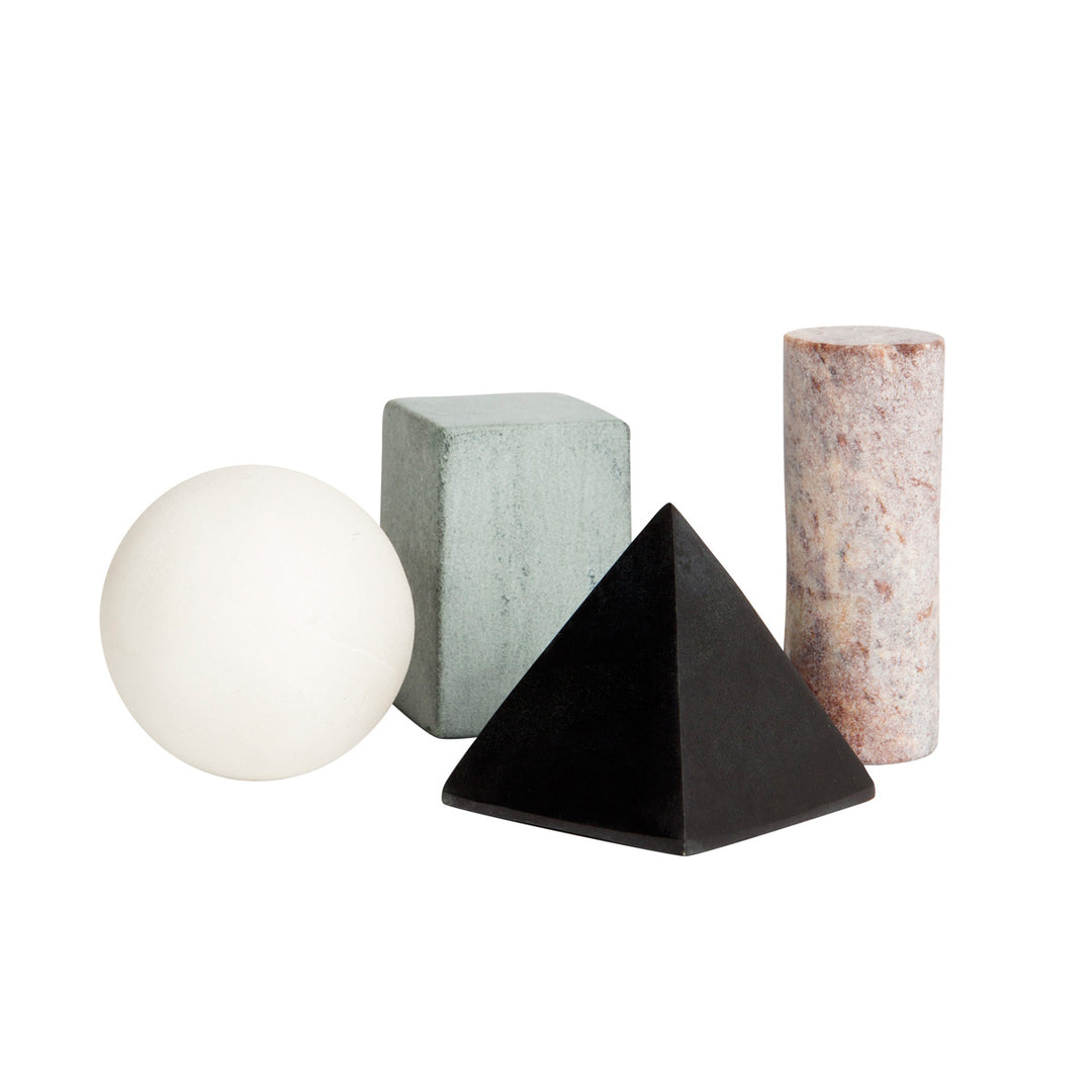 An assortment of geometric-shaped drink rocks, including a sphere, a triangular prism, a tetrahedron, and a roundish object, all in varying colors and textures.