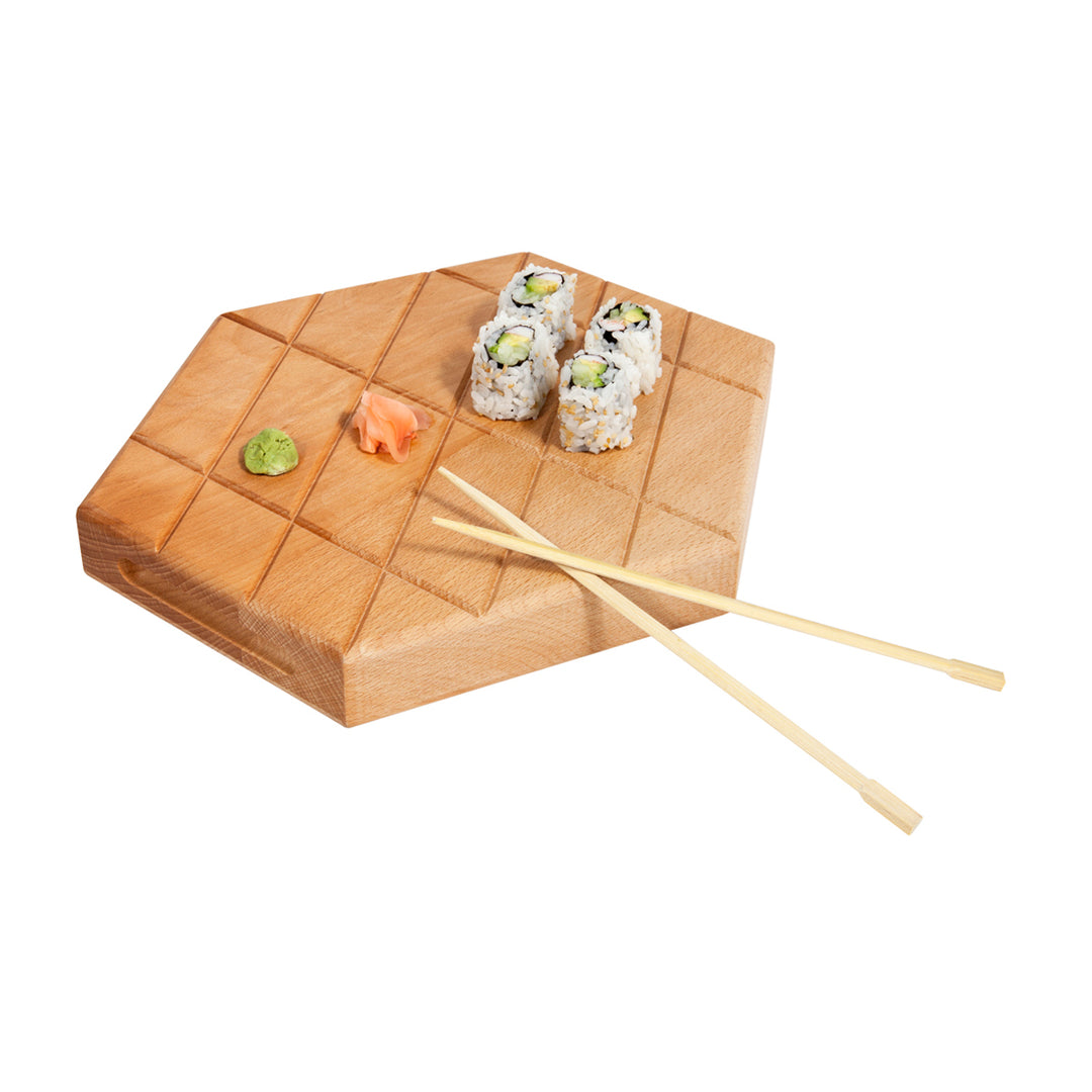 A large, beech wood serving platter with a grid pattern on one side and a smooth side on which to serve food. It has chopsticks placed on it, and a small slice of sushi is visible on the platter.