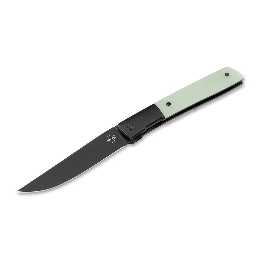 A folding knife with a black titanium handle and green jade handle scales, featuring a locking blade mechanism.