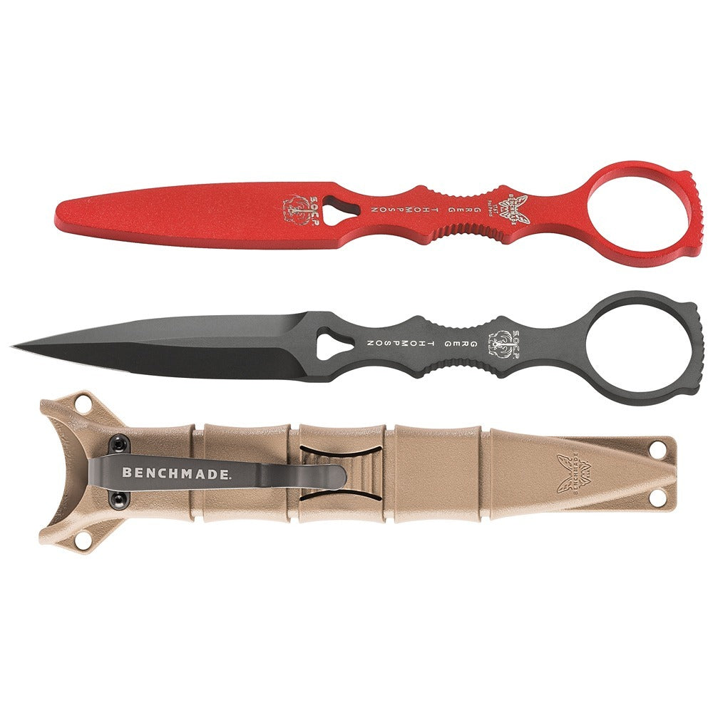 A set of three fixed blade knives from Benchmade, featuring a black dagger design with red and grey sheaths and a sand-colored trainer.